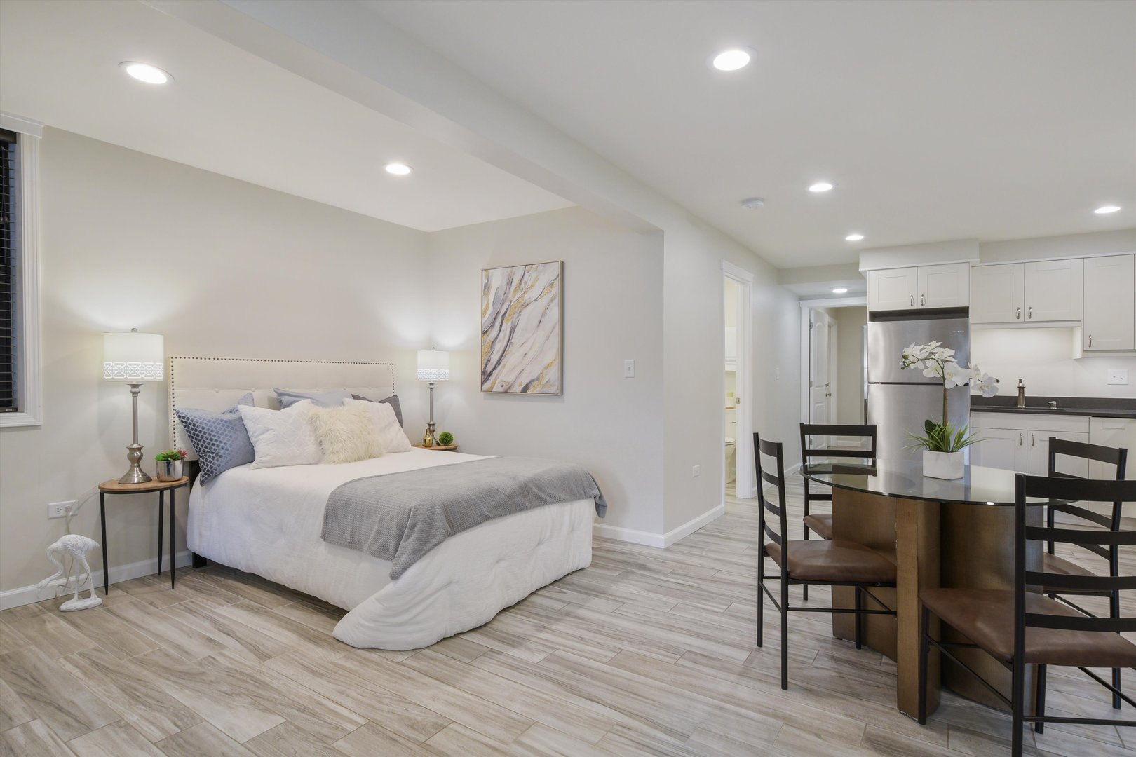 1447 West Flournoy Street Chicago, IL 60607 - Photo 30 of 41 a spacious bedroom with a bed and a table