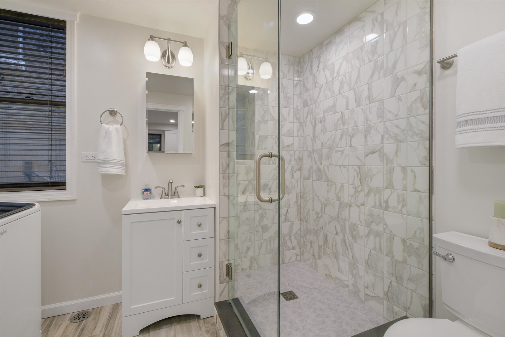 1447 West Flournoy Street Chicago, IL 60607 - Photo 31 of 41 a bathroom with a sink a toilet and shower