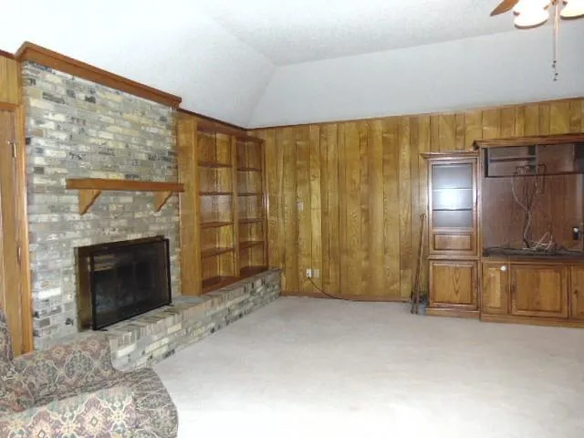 a living room with a couch and a chandelier