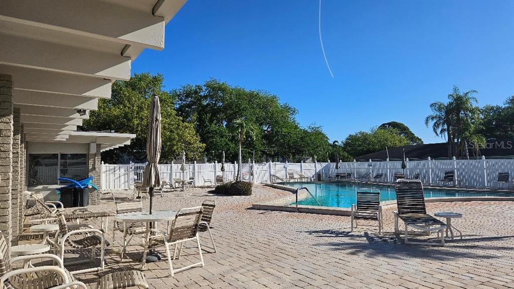 4600 98th Way North, Unit 210 St. Petersburg, FL 33708 - Photo 33 of 33 a view of a backyard with sitting area