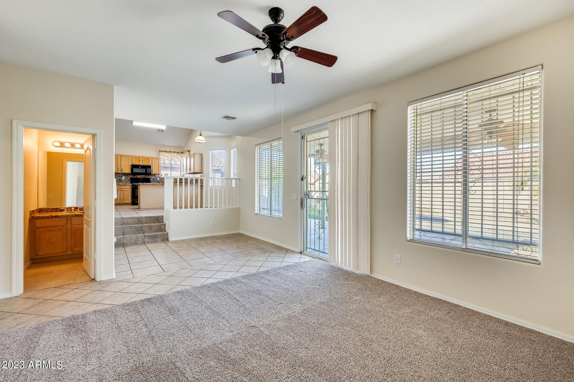 3244 West Maldonado Road Phoenix, AZ 85041 - Photo 18 of 43 a view of livingroom with hardwood floor and a ceiling fan