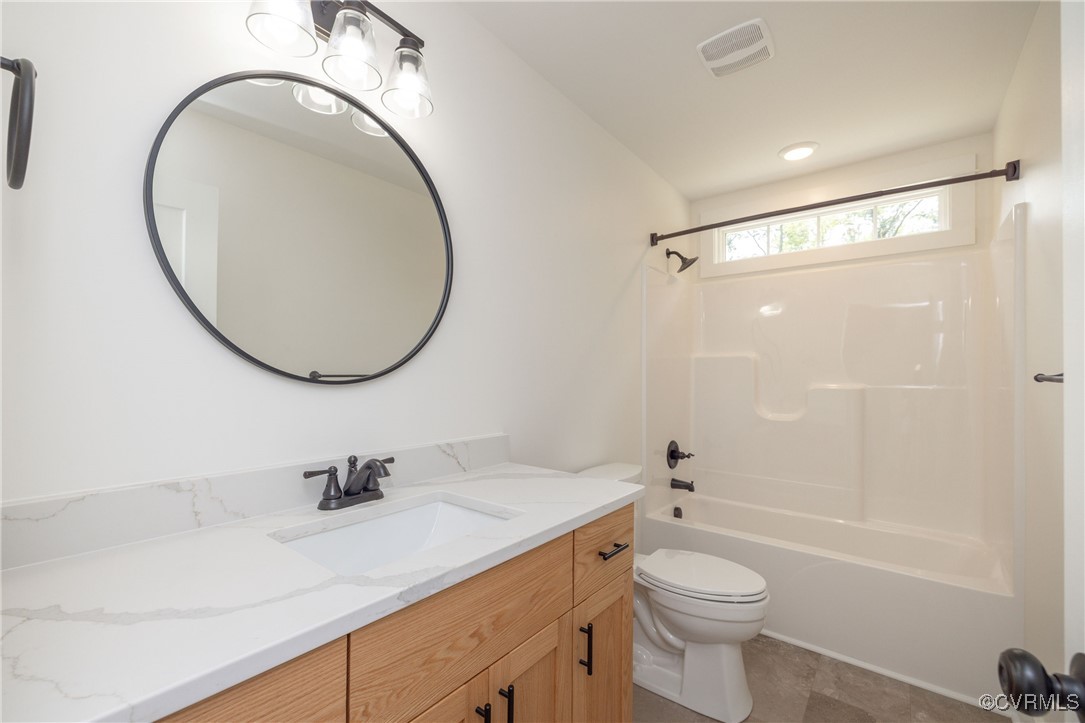 1304 Trimmers Shop Rd Point West Point, VA 23181 - Photo 11 of 12 a bathroom with a sink a toilet and a mirror