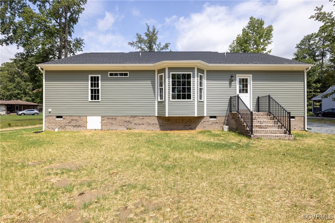 1304 Trimmers Shop Rd Point West Point, VA 23181 - Photo 12 of 12 a view of a house with a backyard and a tree