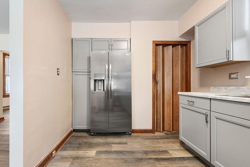3518 7th Avenue Beaver Falls, PA 15010 - Photo 15 of 28 a view of a refrigerator in kitchen and white cabinets