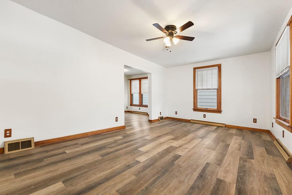 3518 7th Avenue Beaver Falls, PA 15010 - Photo 3 of 28 a view of empty room with wooden floor and fan