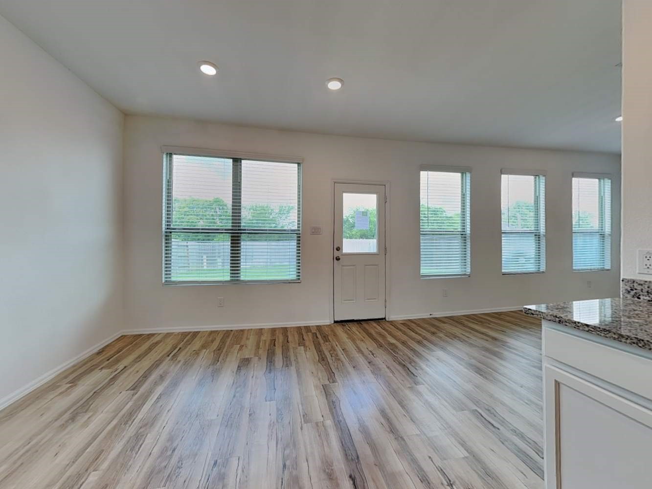 18743 Jasper Rdg Drive Hockley, TX 77447 - Photo 6 of 15 an empty room with wooden floor and windows