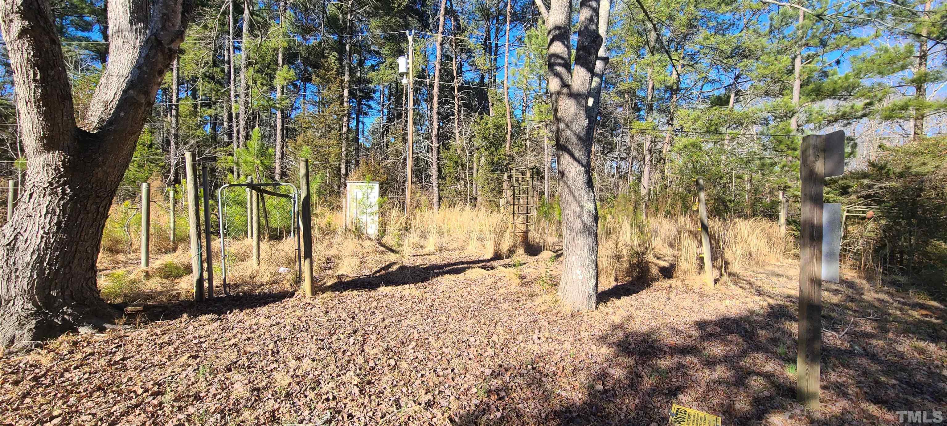 408 Ranch Road Chapel Hill, NC 27516 - Photo 2 of 3 a view of a backyard of the house
