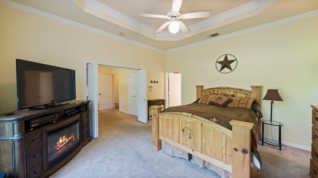 875 Arnold Paul Road Canton, TX 75103 - Photo 14 of 32 a bedroom with furniture and a flat screen tv