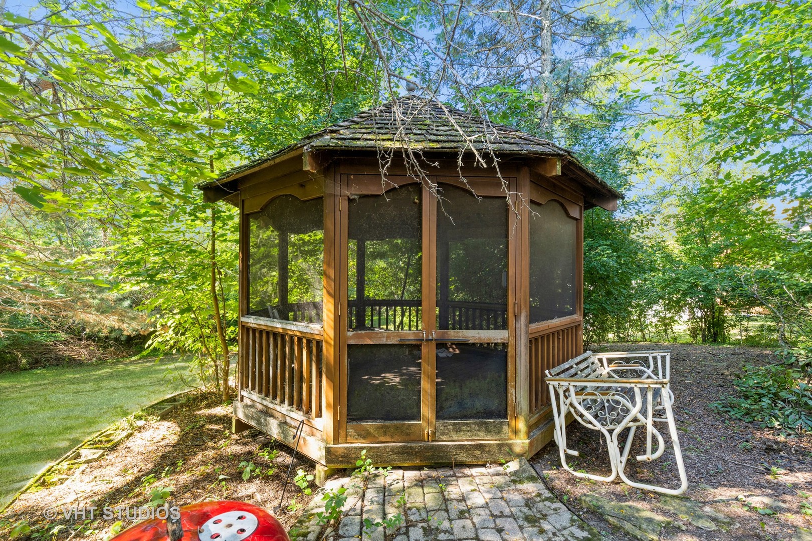 1335 Zange Drive Algonquin, IL 60102 - Photo 22 of 22 a view of a chair and table in backyard of the house