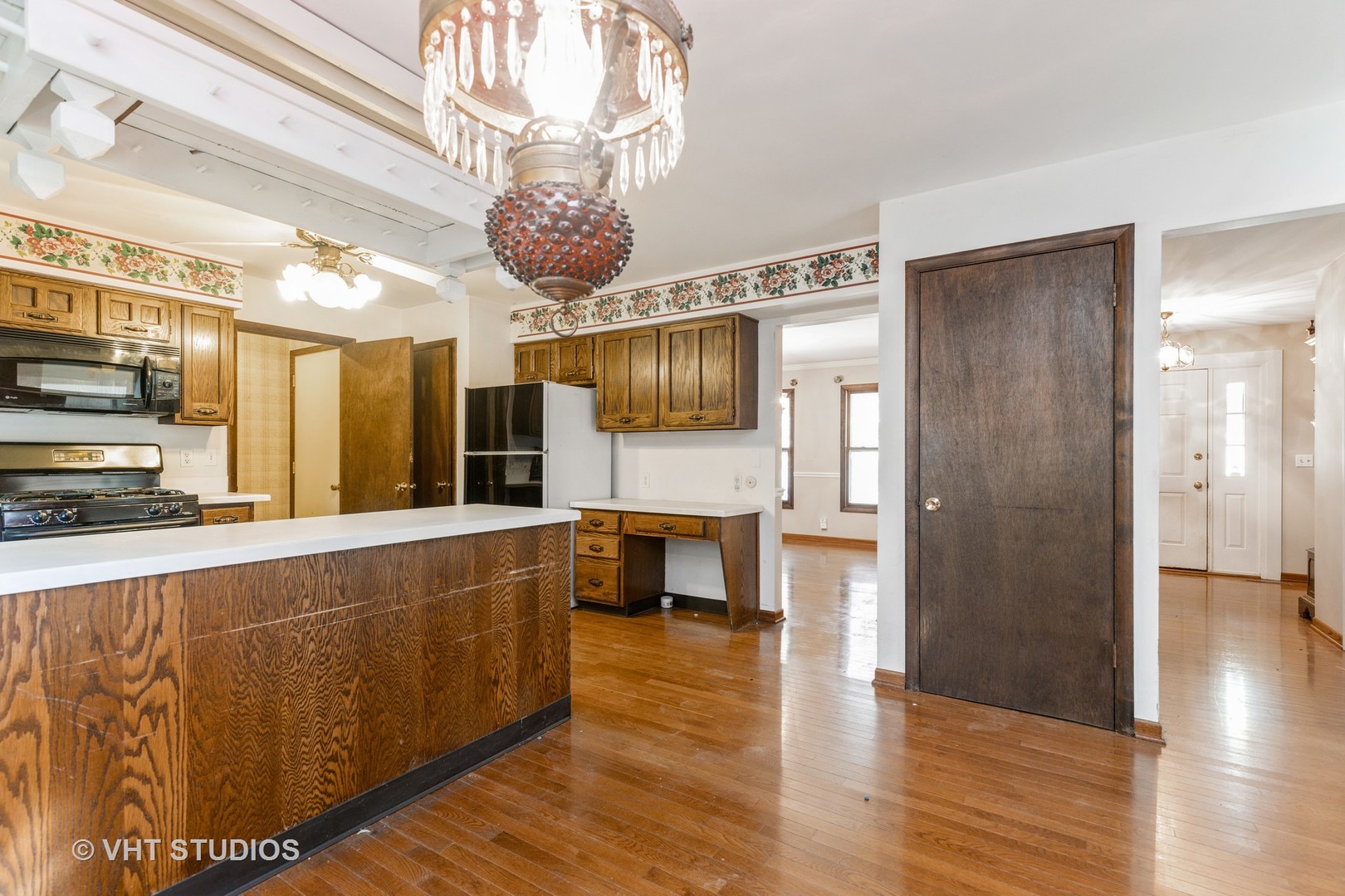1335 Zange Drive Algonquin, IL 60102 - Photo 9 of 22 a living room with stainless steel appliances kitchen island granite countertop furniture and a fireplace