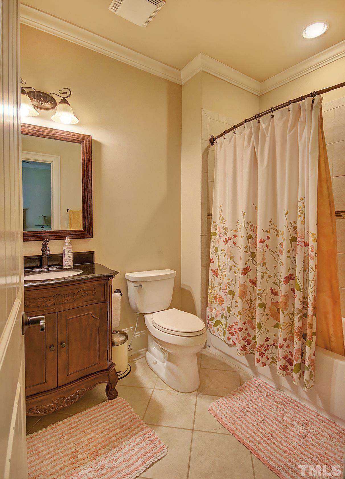 12440 Peed Road Raleigh, NC 27614 - Photo 18 of 33 a bathroom with a granite countertop sink toilet and shower