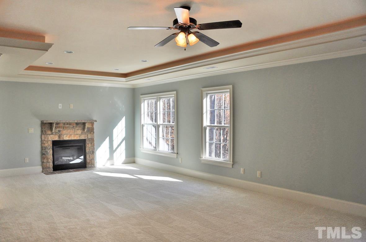 12440 Peed Road Raleigh, NC 27614 - Photo 10 of 33 a view of livingroom a fireplace and a window