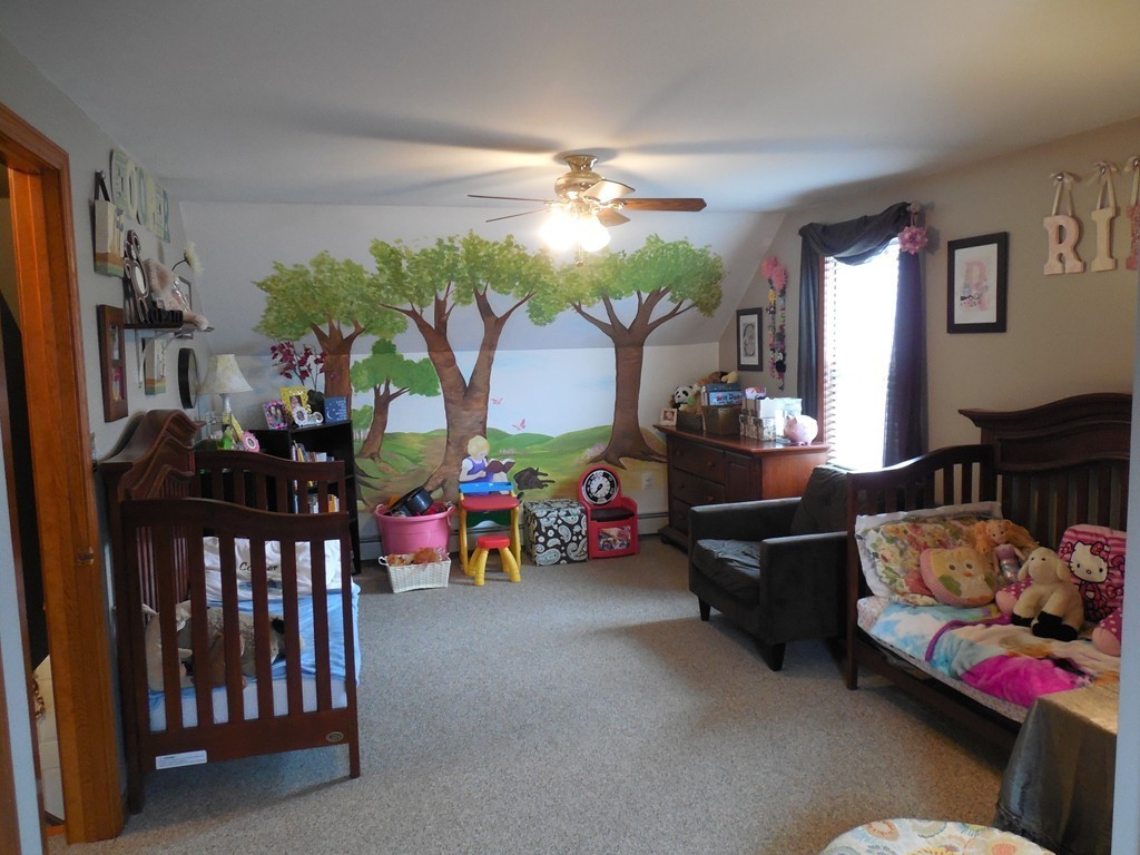 252 Pelham Street Fall River, MA 02721 - Photo 15 of 18 a living room with lots of furniture and a chandelier