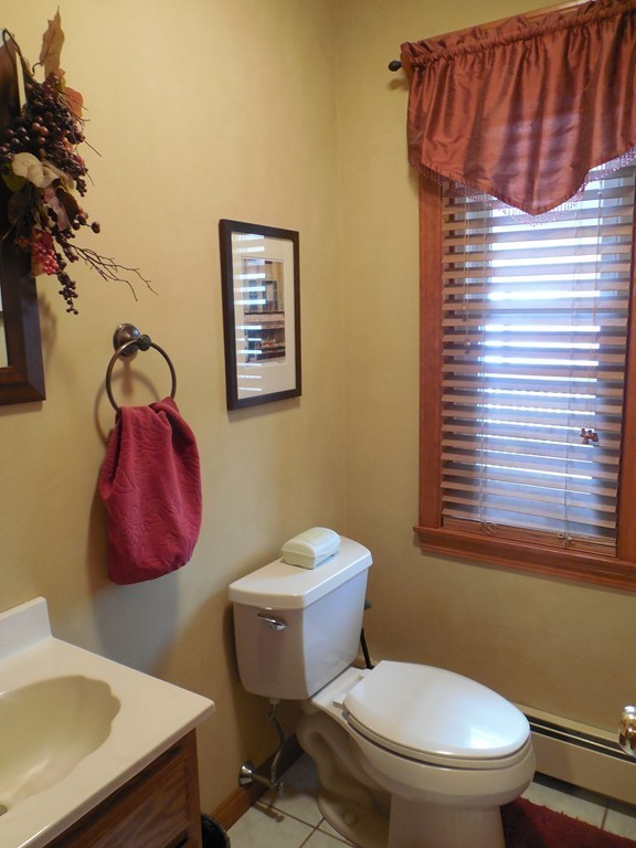 252 Pelham Street Fall River, MA 02721 - Photo 17 of 18 a white toilet sitting next to a bathroom sink