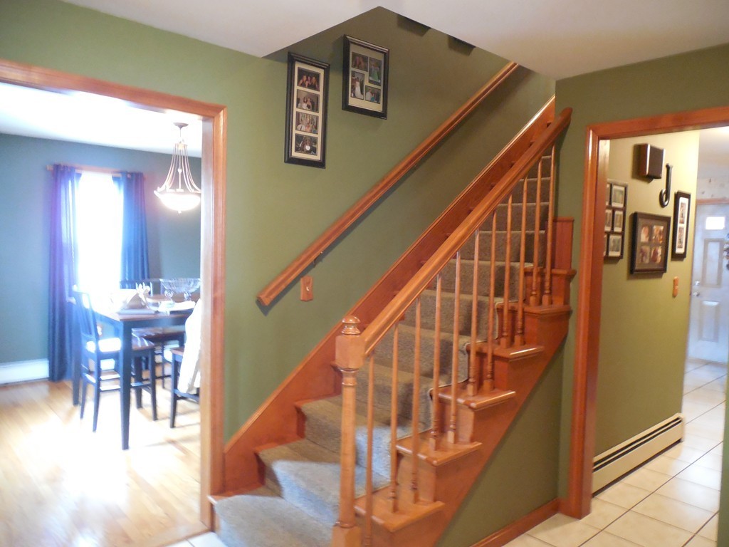 252 Pelham Street Fall River, MA 02721 - Photo 7 of 18 a view of entryway and hall with wooden floor