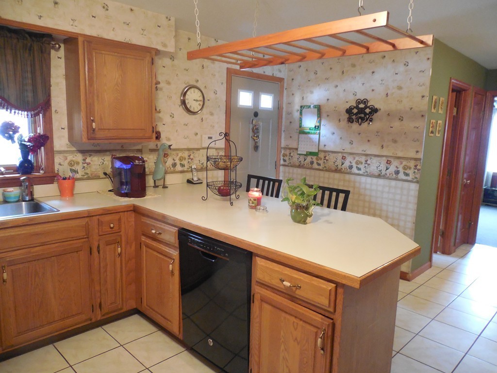 252 Pelham Street Fall River, MA 02721 - Photo 10 of 18 a kitchen with a sink cabinets and window