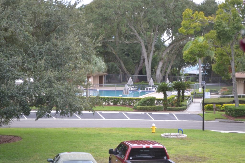 2375 Fox Chase Boulevard, Unit 260 Palm Harbor, FL 34683 - Photo 12 of 38 a front view of a house with garden