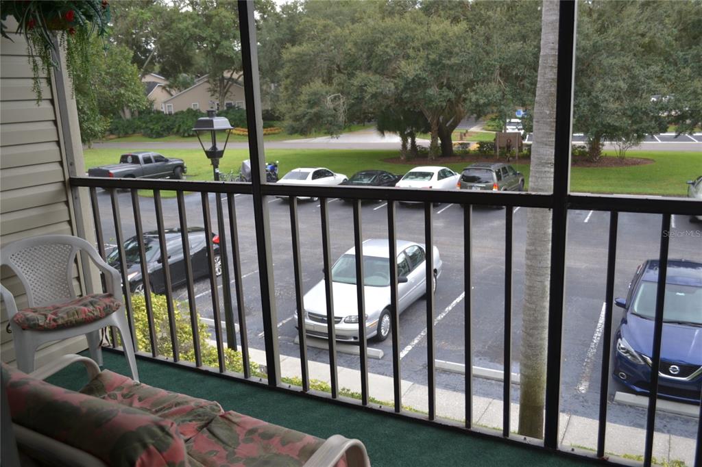 2375 Fox Chase Boulevard, Unit 260 Palm Harbor, FL 34683 - Photo 16 of 38 a view of a porch with a yard
