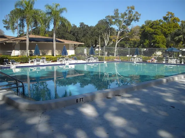 a view of swimming pool with a yard
