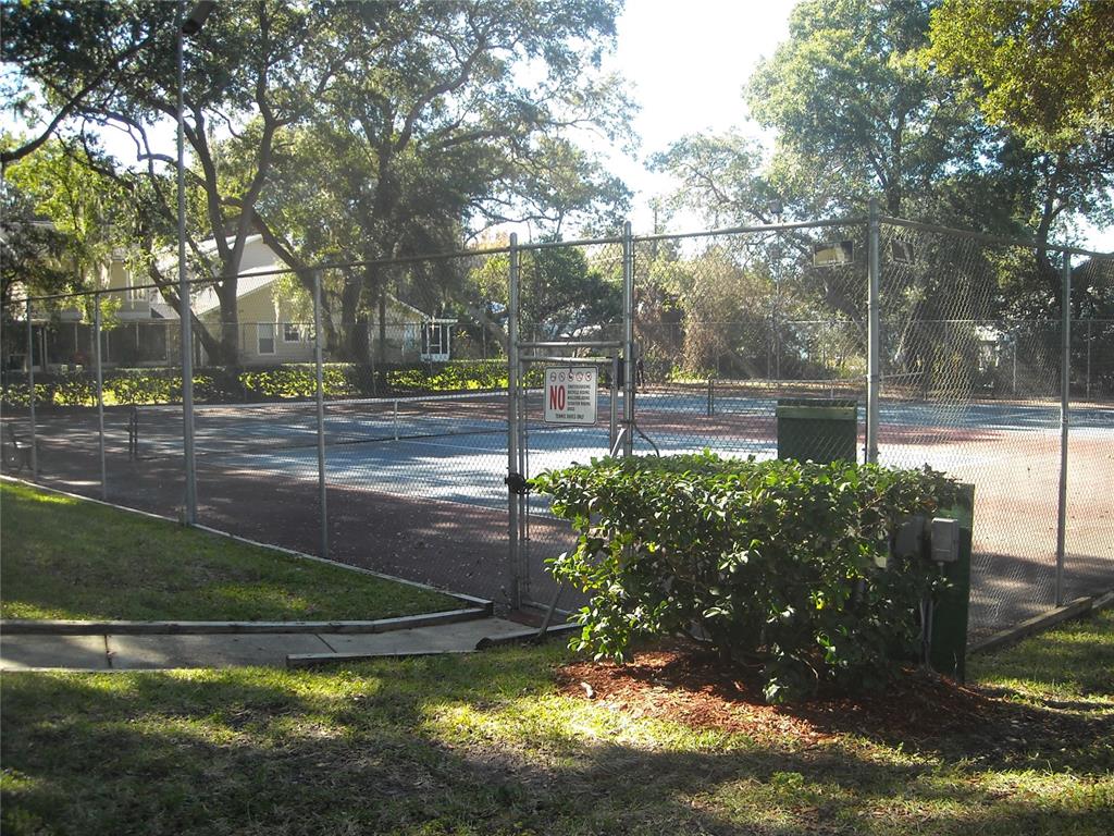 2375 Fox Chase Boulevard, Unit 260 Palm Harbor, FL 34683 - Photo 24 of 38 a view of a street with large trees