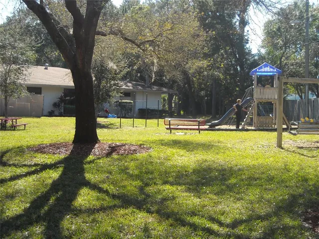 a view of a swimming pool with an outdoor space and seating area