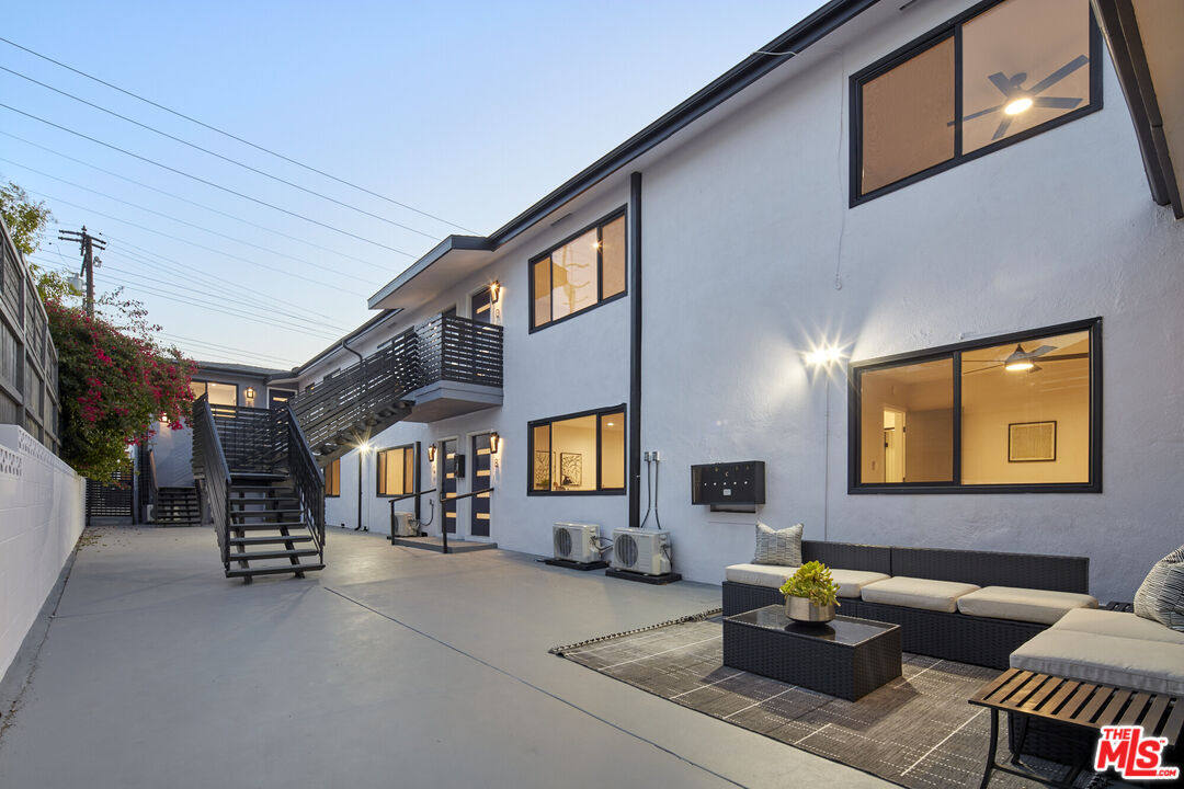 a lobby with furniture and a flat screen tv