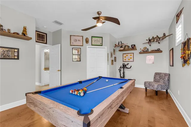 a living room with furniture flat screen tv and a window