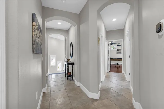 a kitchen with a refrigerator and a sink