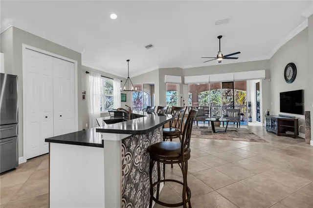 a view of a dining room with furniture window and outside view