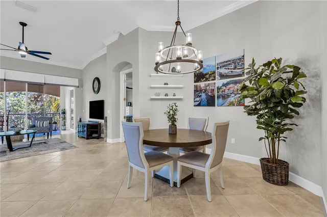 a view of a dining room that has a table and chairs