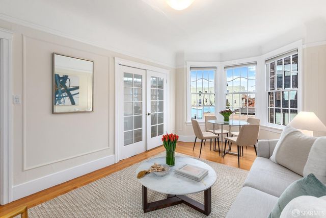a living room with furniture and a table
