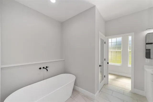 a bathroom with a bathtub and shower