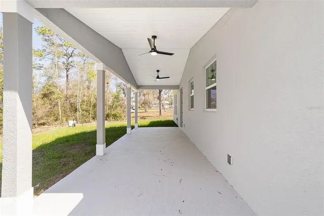 a view of a house with yard and a garden