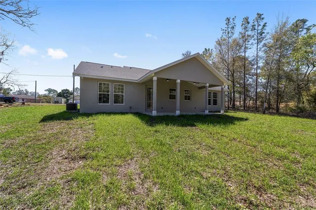 a view of a city with lush green forest