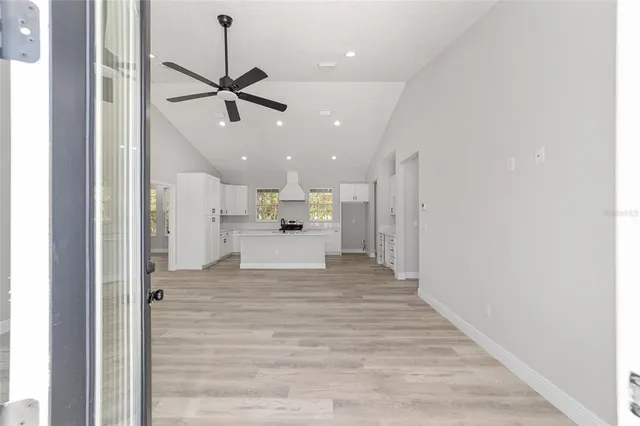 a view of a kitchen with a sink and cabinet