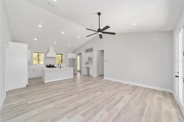 a view of kitchen with wooden floor and window