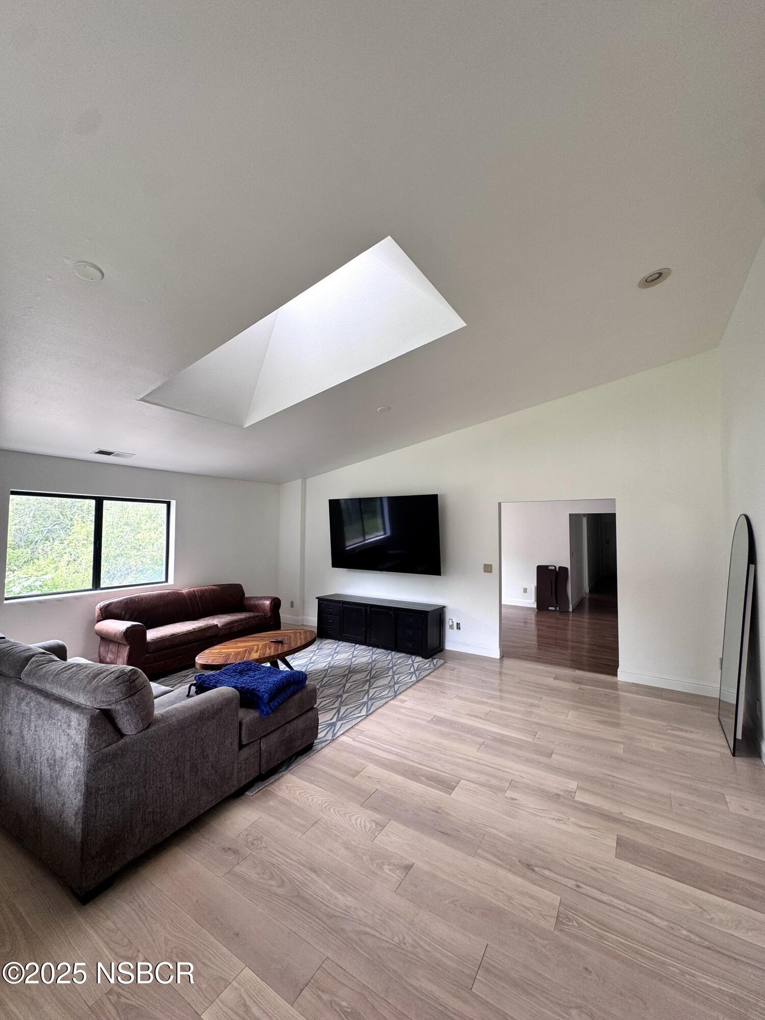 1485 San Miguelito Road Lompoc, CA 93436 - Photo 2 of 10 a living room with furniture flat screen tv and a fireplace