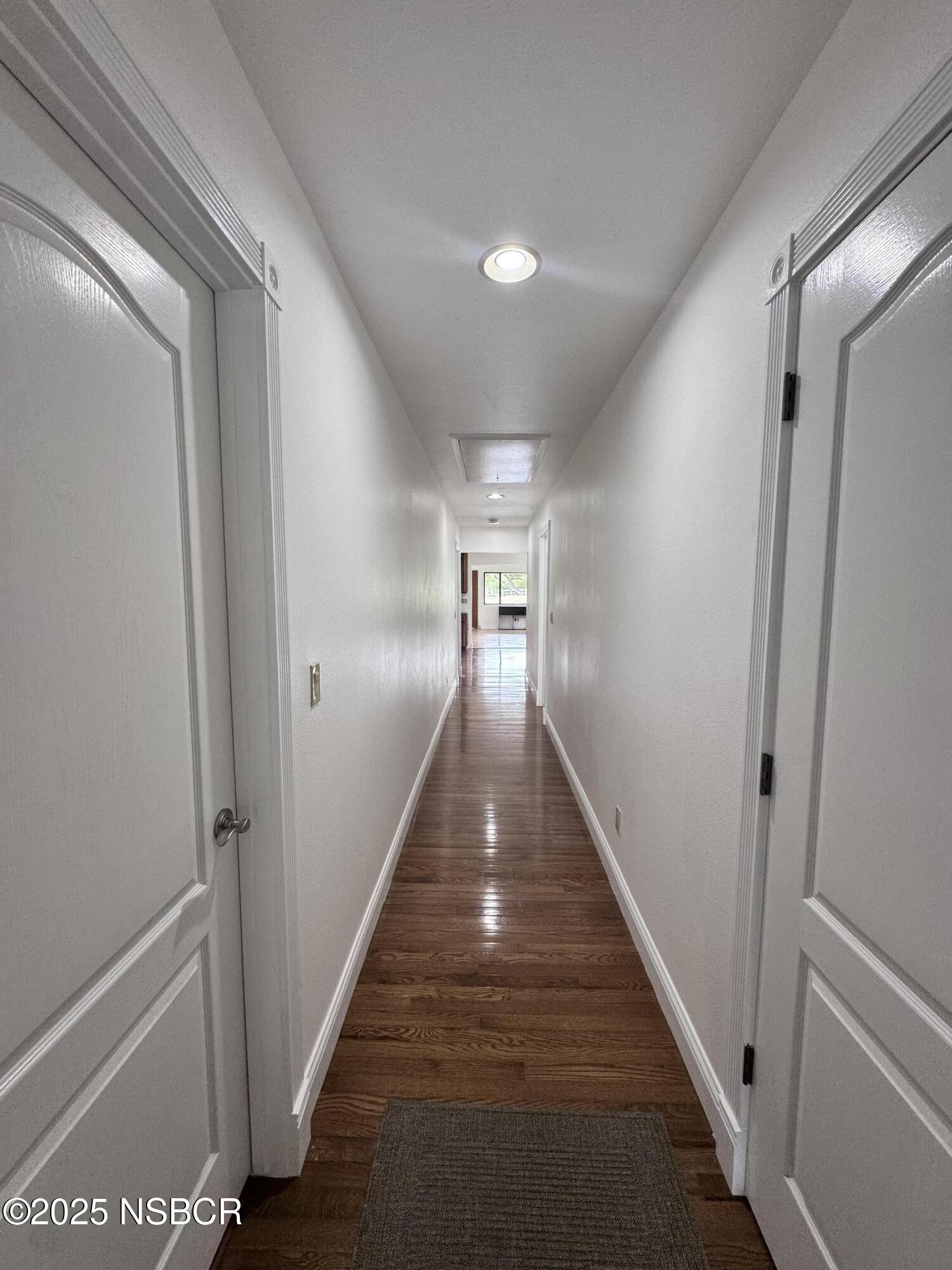 1485 San Miguelito Road Lompoc, CA 93436 - Photo 4 of 10 a view of a hallway with wooden floor