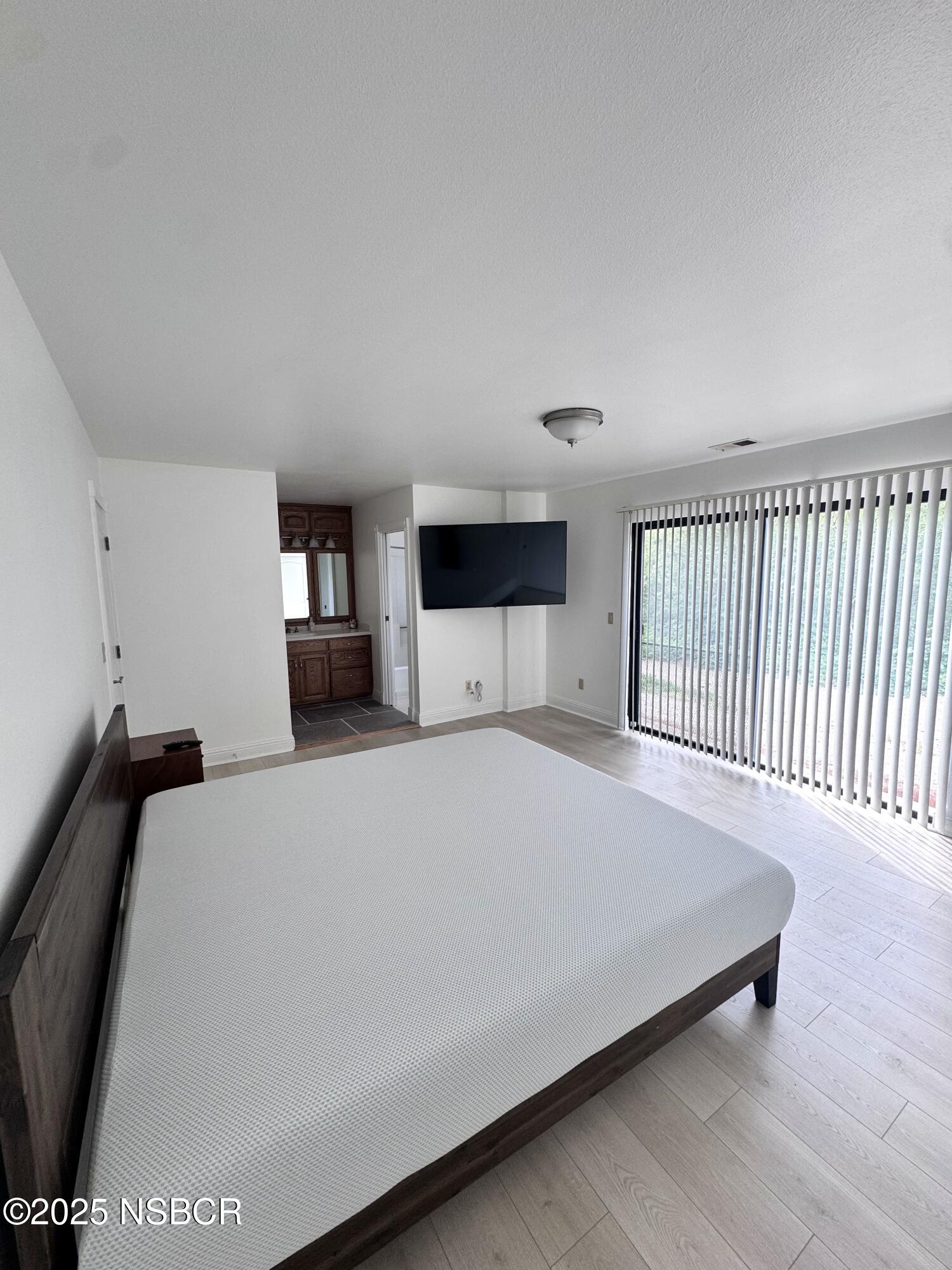 1485 San Miguelito Road Lompoc, CA 93436 - Photo 6 of 10 a bed room with a bed and a television