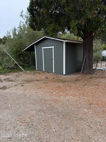 a house with trees in the background