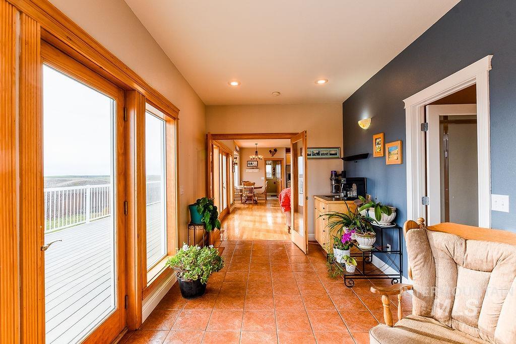 18072 Central Grd Genesee, ID 83832 - Photo 23 of 50 Hall with recessed lighting, light tile patterned floors, and a chandelier