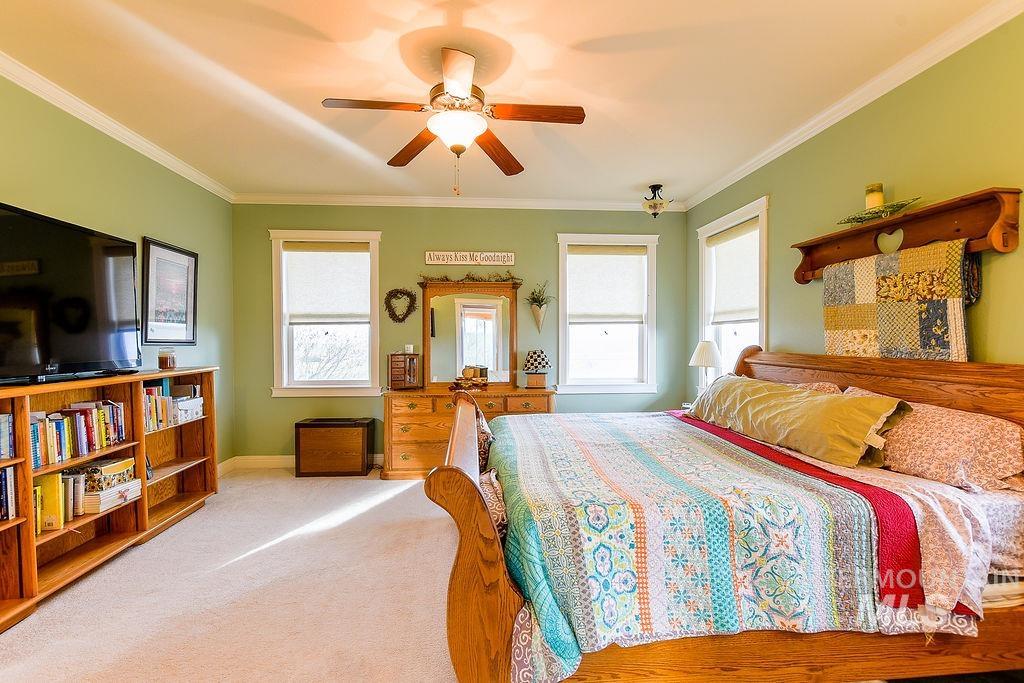18072 Central Grd Genesee, ID 83832 - Photo 24 of 50 Bedroom featuring crown molding, light carpet, and ceiling fan