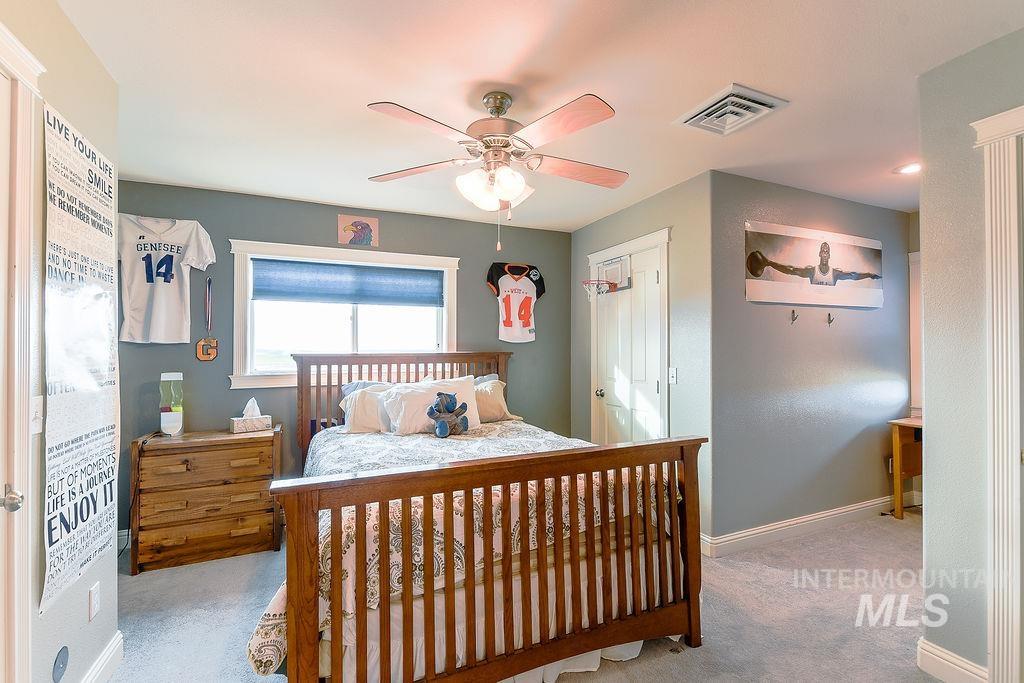 18072 Central Grd Genesee, ID 83832 - Photo 30 of 50 Bedroom featuring ceiling fan, carpet floors, and a closet