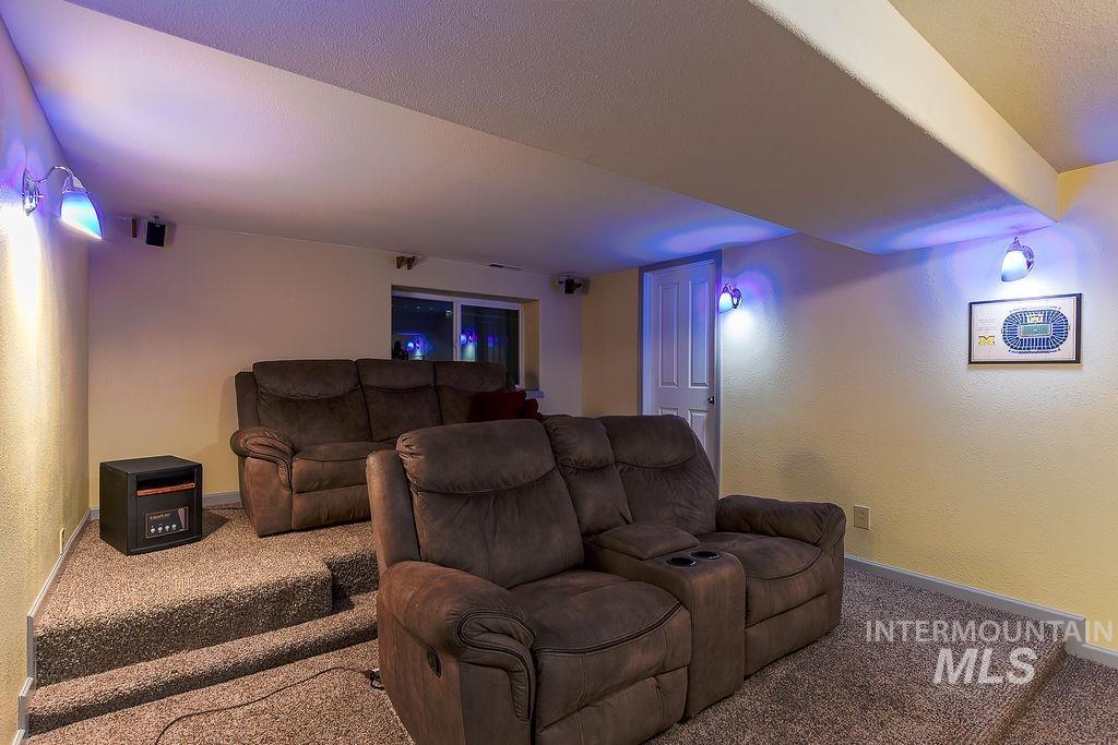 18072 Central Grd Genesee, ID 83832 - Photo 35 of 50 Carpeted home theater room with a textured wall and a textured ceiling