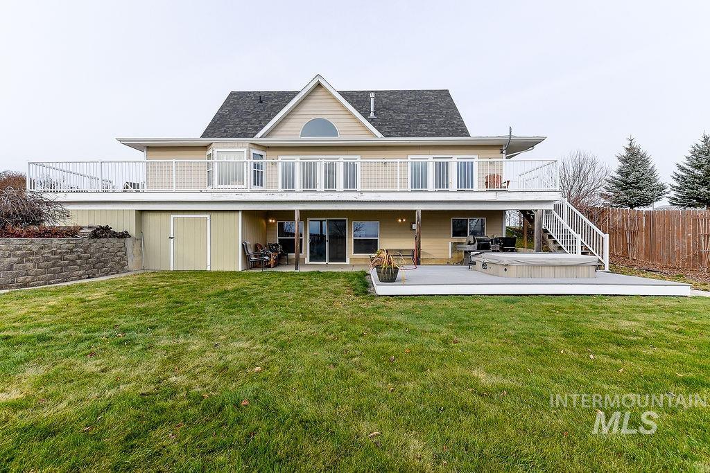 18072 Central Grd Genesee, ID 83832 - Photo 46 of 50 Back of house with a hot tub, a patio area, stairs, and a wooden deck