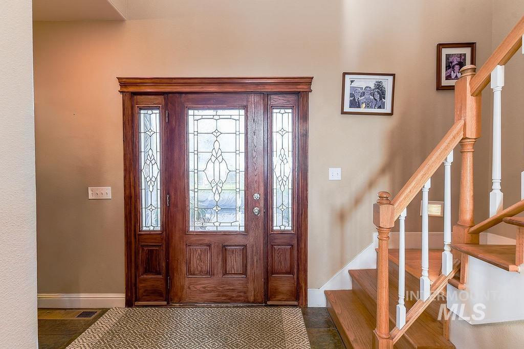 18072 Central Grd Genesee, ID 83832 - Photo 8 of 50 Foyer with stairs and baseboards