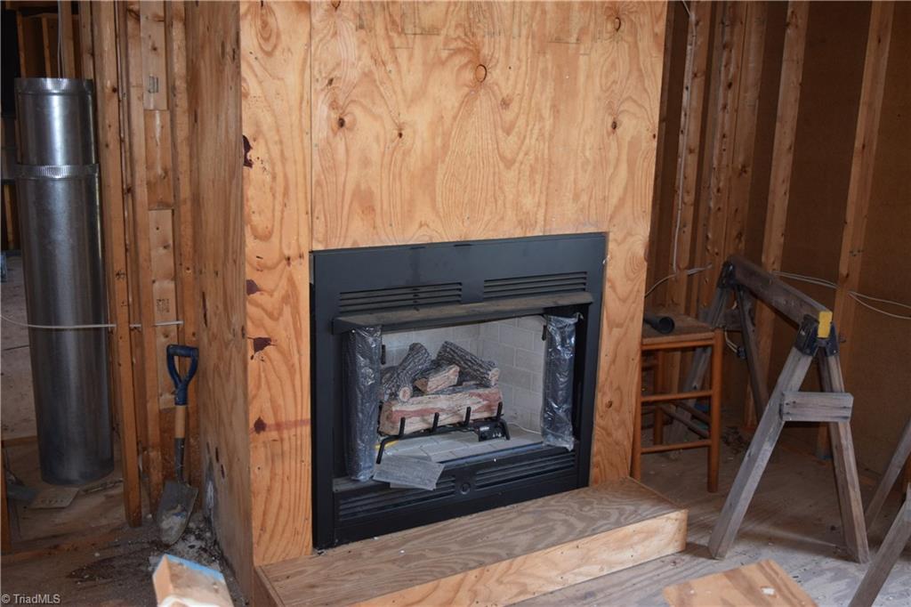 700 Lemons Road Stokesdale, NC 27357 - Photo 6 of 27 Living room fireplace