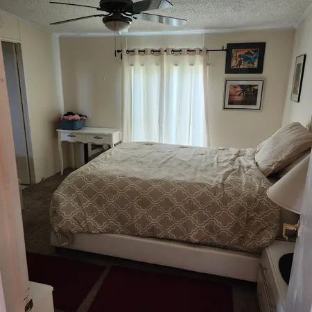 a bedroom with a bed and furniture
