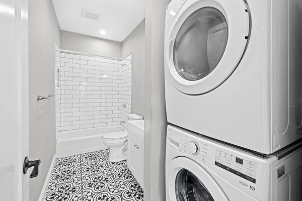 a bathroom with a sink a toilet and a shower
