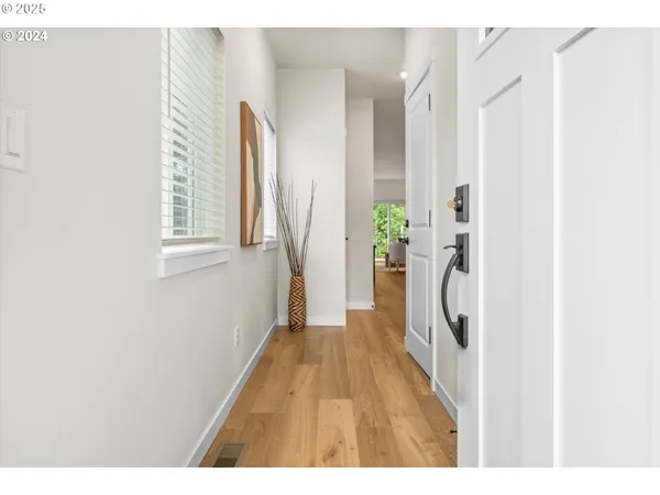 a hallway with a white wooden door